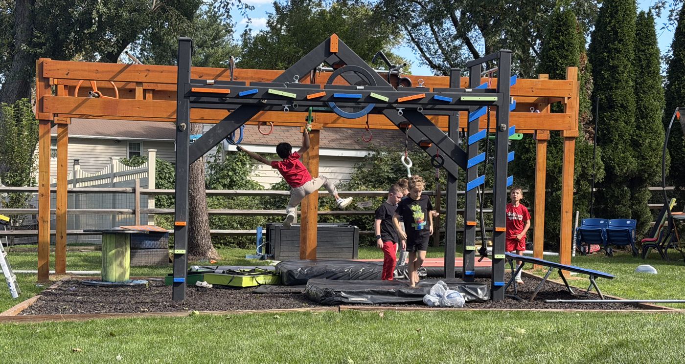 Josiah and Frankie training with friends on a backyard ninja course